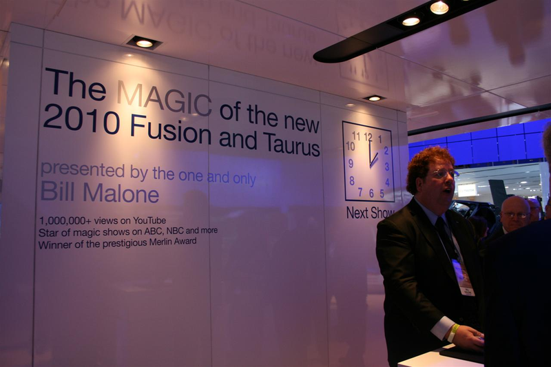 Illustration for article titled Caption This: Magician Bill Malone Deals Ford America Prez Mark Fields From The Bottom Of The Deck